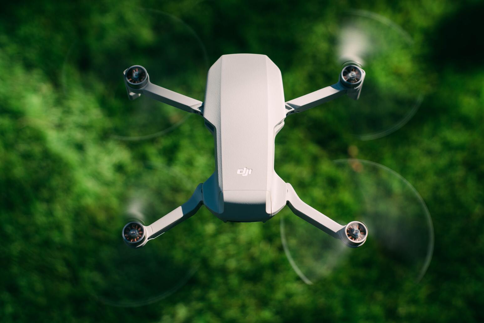 Photo of an agricultural drone flying over greenery