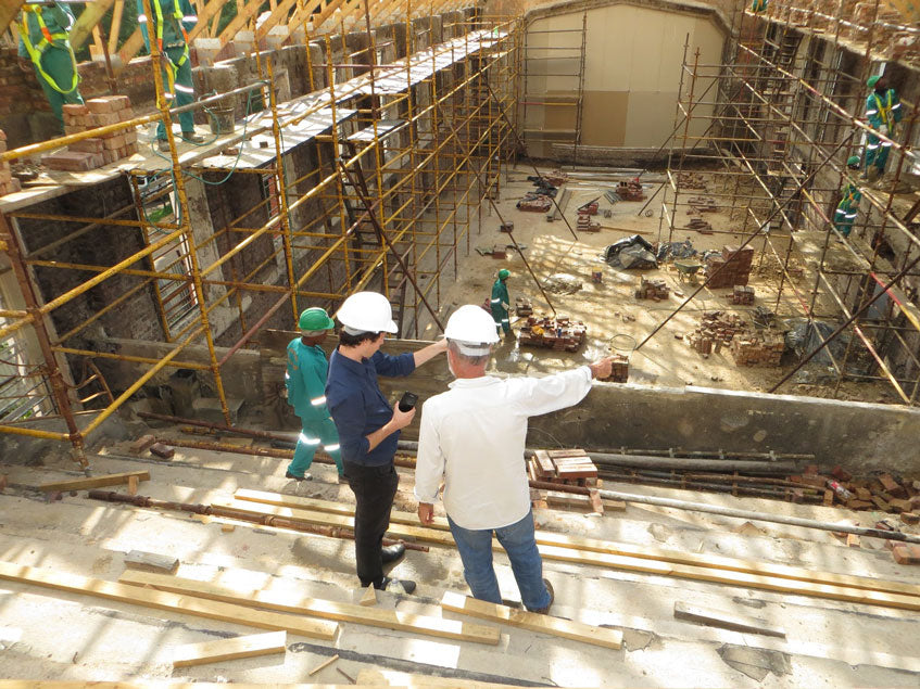 two-construction-workers-talking