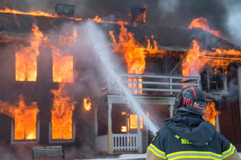 Fireman putting out a house fire